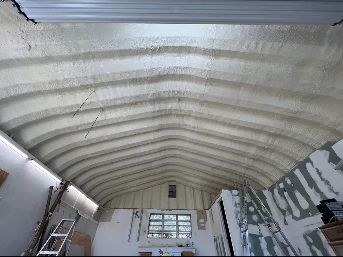 Spray polyurethane foam applied to the underside of a metal roof deck in Cynthiana